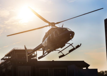 Can pilots legally land a helicopter in a fast-food parking lot?